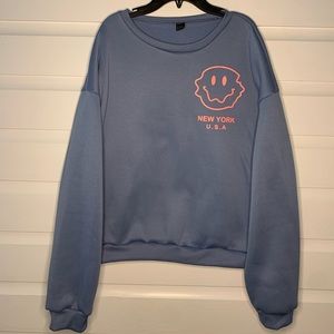 Medium blue smiley face crewneck